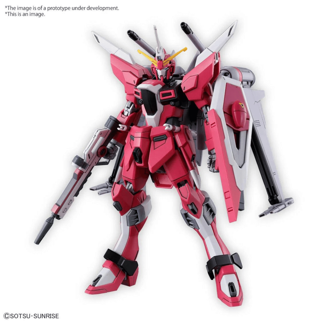 The HGCE Infinite Justice Gundam Type II in neutral sanding pose, featuring its beam rifle and shield.